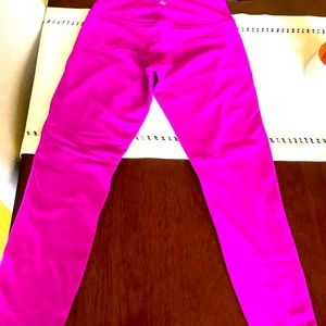 Lululemon pink leggings.  Barely used Great condition. Free Lululemon large bag.